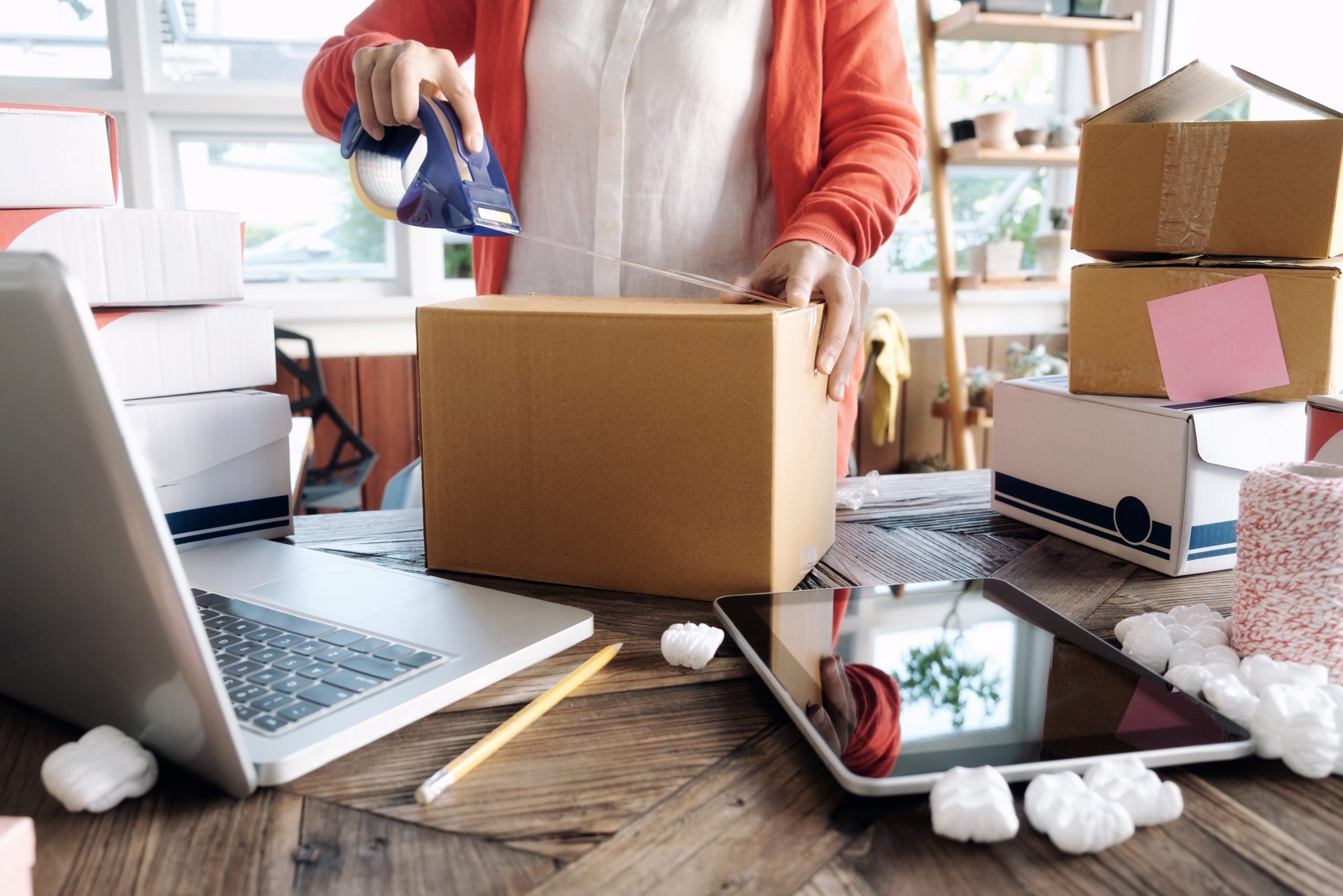 Young startup entrepreneur small business owner working at home, packaging and delivery situation. Business Start up SME concept. Young startup entrepreneur small business owner working at home, packaging and delivery situation.