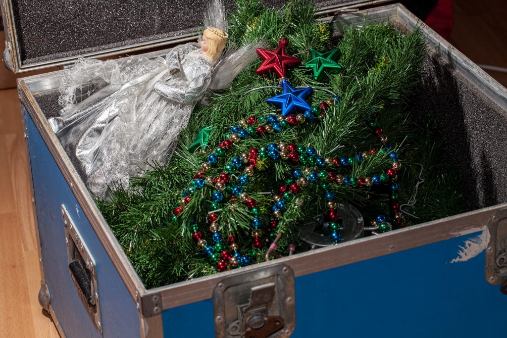 Christmas tree decorations taken down and packed away in storage. Christmas tree decorations taken down and packed away in storage. End or start of the Xmas holiday. Packing and unpacking the fake Christmas tree, fairy and baubles.